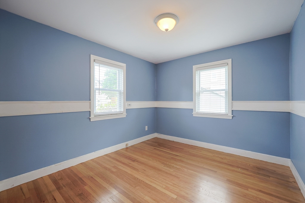 20 Kent Street Saugus, MA 01906 - Photo 14 of 41 an empty room with wooden floor and windows