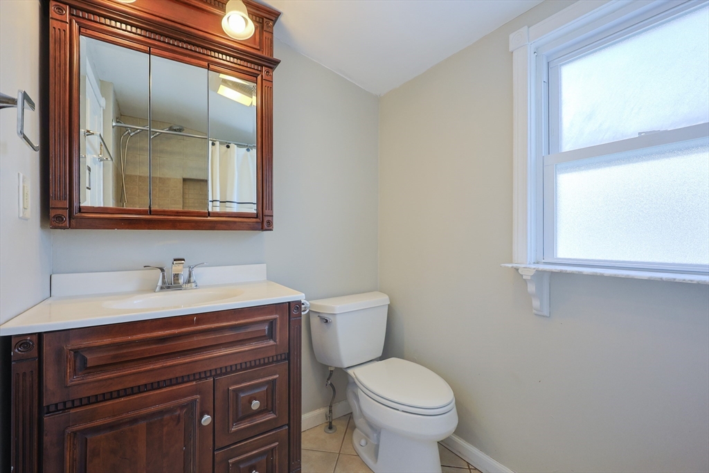 20 Kent Street Saugus, MA 01906 - Photo 18 of 41 a bathroom with a toilet sink and mirror