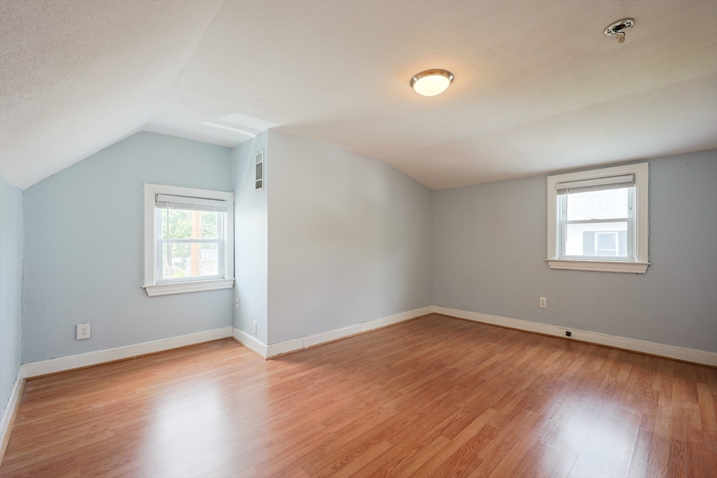 20 Kent Street Saugus, MA 01906 - Photo 20 of 41 a view of an empty room with wooden floor and a window