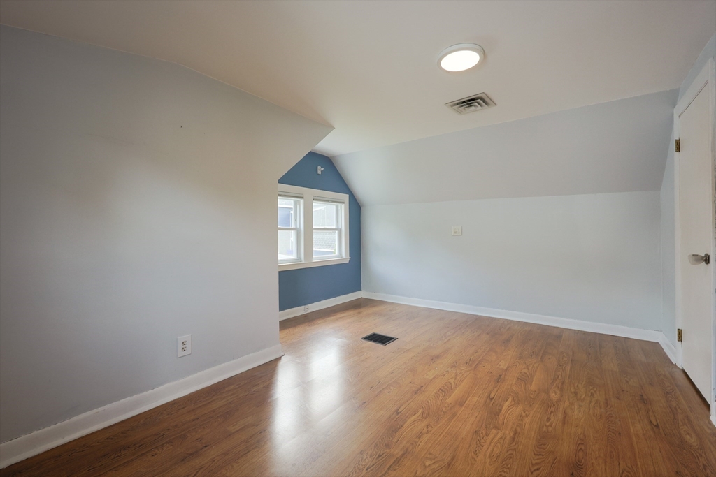 20 Kent Street Saugus, MA 01906 - Photo 22 of 41 an empty room with wooden floor and windows