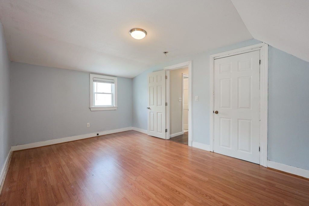 20 Kent Street Saugus, MA 01906 - Photo 23 of 41 a view of an empty room with wooden floor and a window