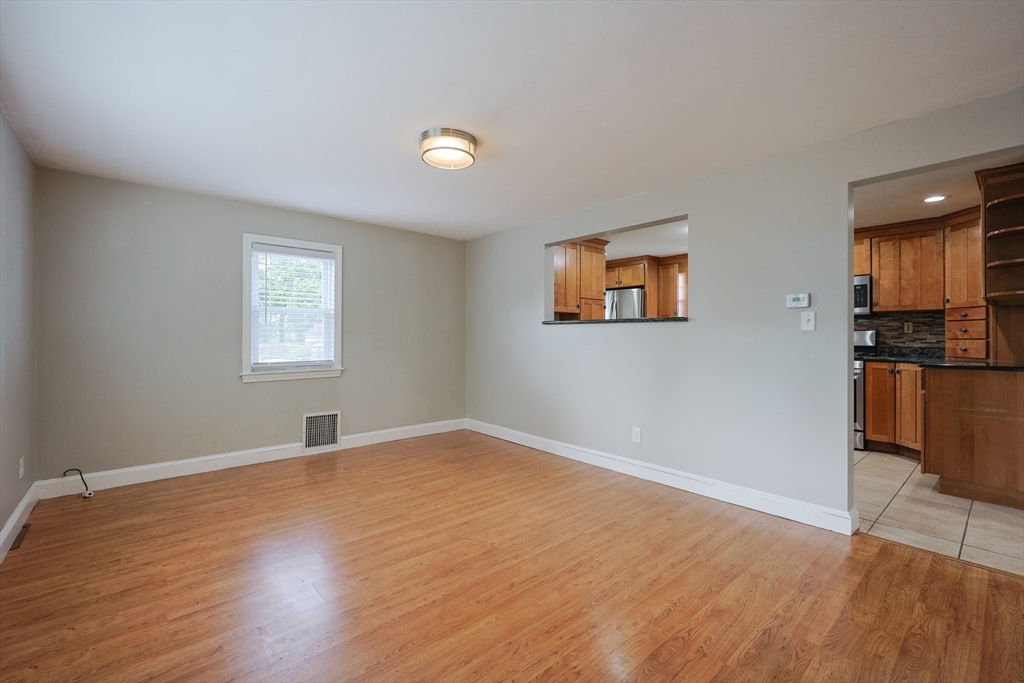 20 Kent Street Saugus, MA 01906 - Photo 25 of 41 a view of an empty room with window and wooden floor