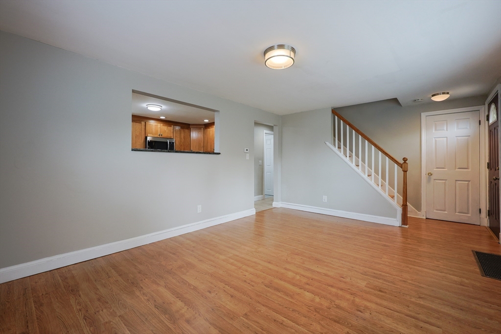 20 Kent Street Saugus, MA 01906 - Photo 26 of 41 a view of an empty room with wooden floor and a window