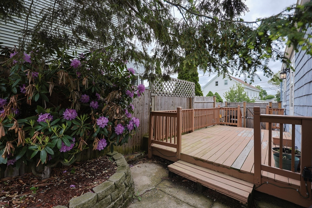 20 Kent Street Saugus, MA 01906 - Photo 37 of 41 a view of a roof deck with wooden fence and a couple of flower