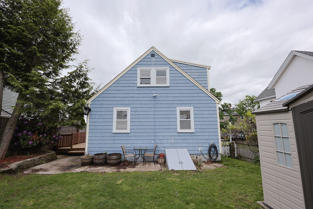 20 Kent Street Saugus, MA 01906 - Photo 39 of 41 a front view of house with yard and outdoor seating