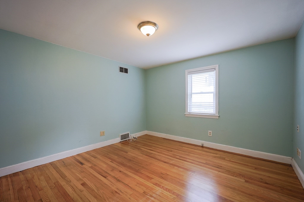 20 Kent Street Saugus, MA 01906 - Photo 9 of 41 an empty room with wooden floor and windows