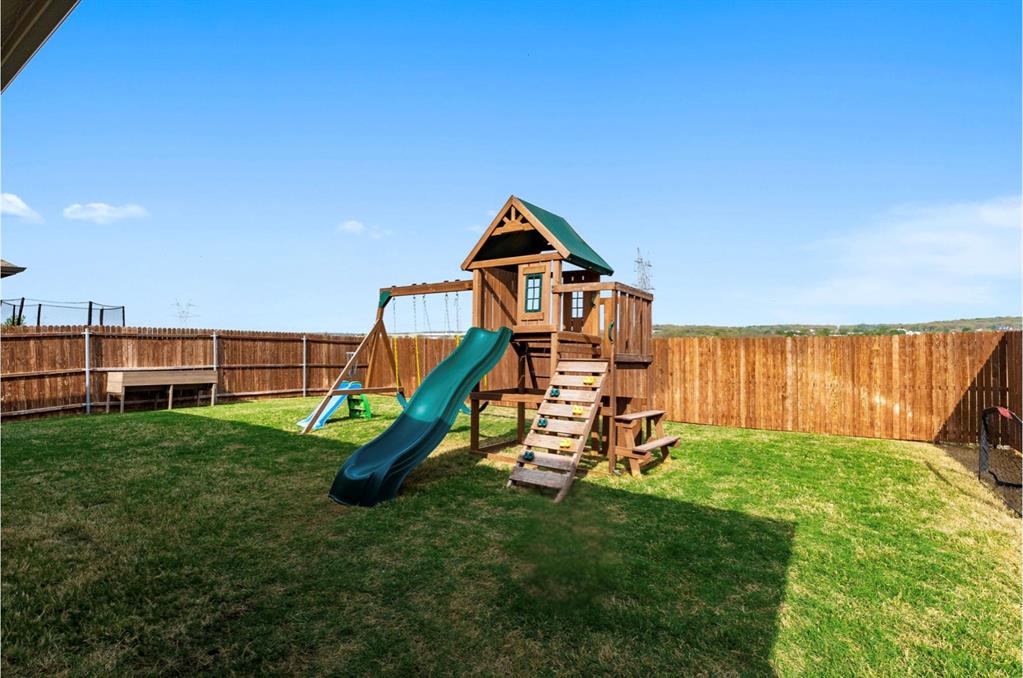1125 Knightsbridge Road Argyle, TX 76226 - Photo 20 of 27 a view of a park with a slide