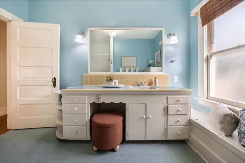 a bathroom with a sink and a mirror
