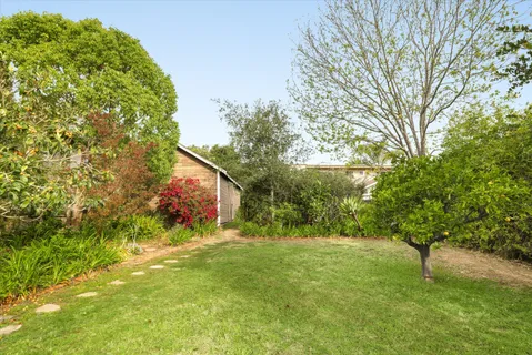 a backyard of a house with lots of green space