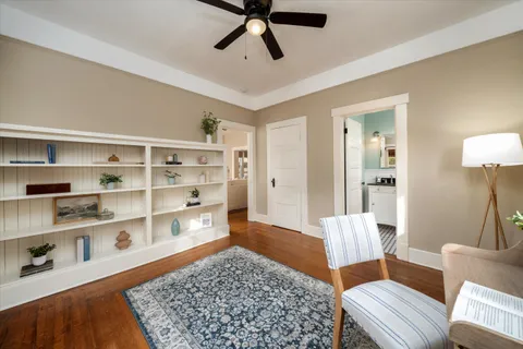 a living room with furniture and a rug