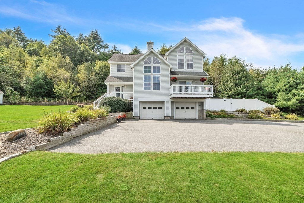 121 Fenton Road Monson, MA 01057 - Photo 3 of 40 a front view of a house with a yard and garage