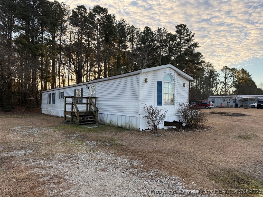 1011 John Godfrey Road Sanford, NC 27332 - Photo 2 of 16 a view of a house with a yard