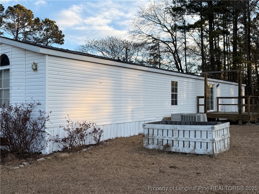 1011 John Godfrey Road Sanford, NC 27332 - Photo 3 of 16 a view of a house with a deck