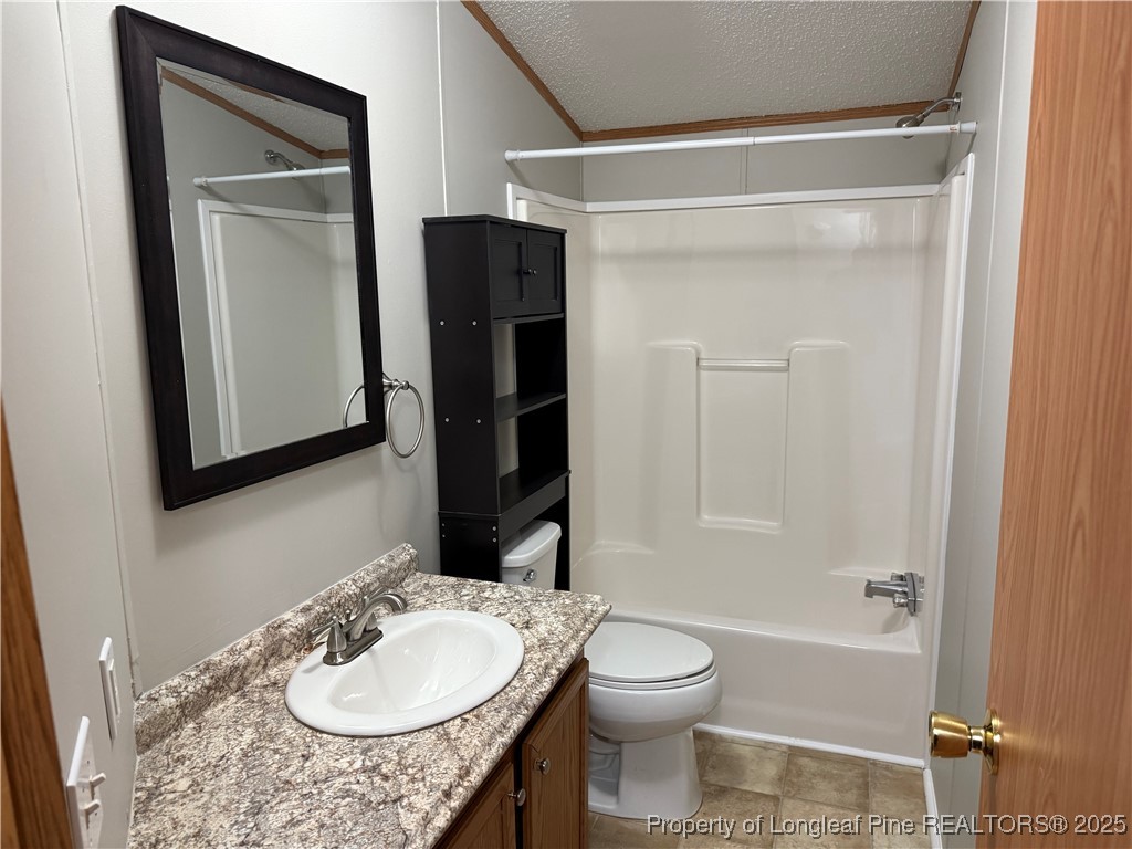 1011 John Godfrey Road Sanford, NC 27332 - Photo 9 of 16 a bathroom with a granite countertop sink toilet and shower