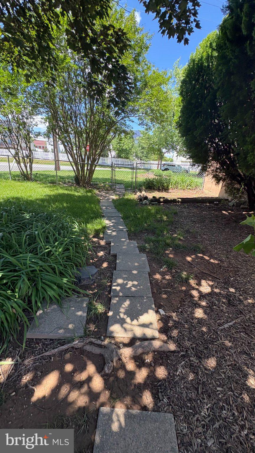 8001 Good Luck Road Lanham, MD 20706 - Photo 11 of 11 Serene garden path under shade