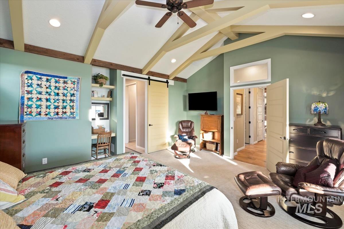 11326 West Rio Road Caldwell, ID 83607 - Photo 18 of 50 Bedroom featuring a barn door, a closet, beam ceiling, carpet floors, and recessed lighting