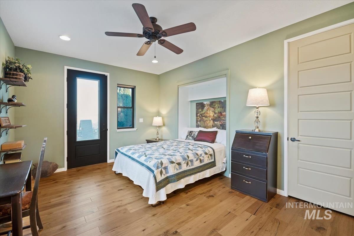 11326 West Rio Road Caldwell, ID 83607 - Photo 23 of 50 Bedroom featuring wood finished floors, a ceiling fan, and recessed lighting