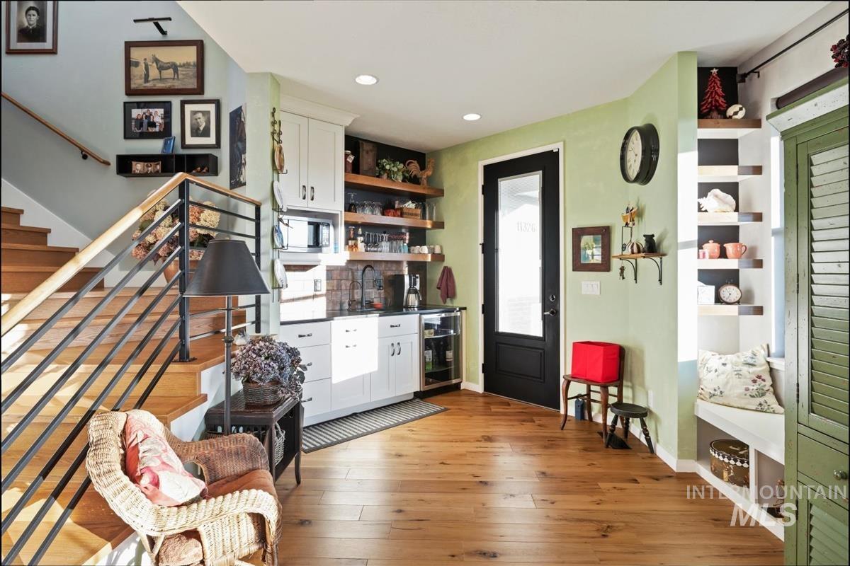 11326 West Rio Road Caldwell, ID 83607 - Photo 26 of 50 Kitchen featuring open shelves, white cabinetry, light wood-style floors, dark countertops, and recessed lighting