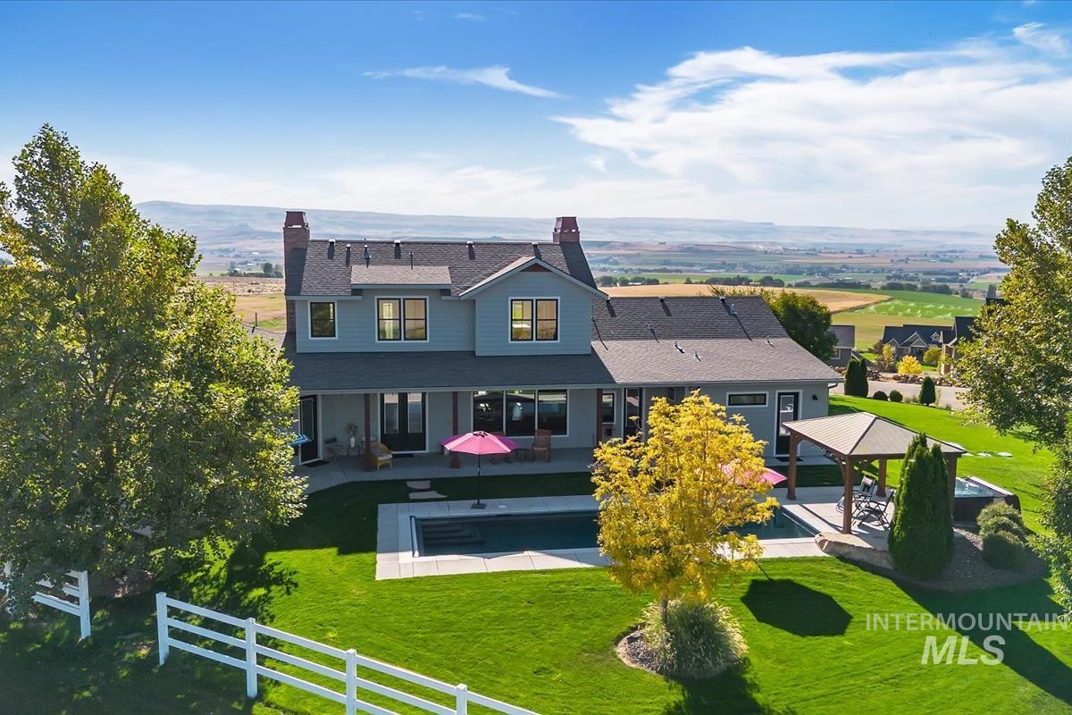 11326 West Rio Road Caldwell, ID 83607 - Photo 40 of 50 Rear view of house with a patio area, a chimney, and a gazebo