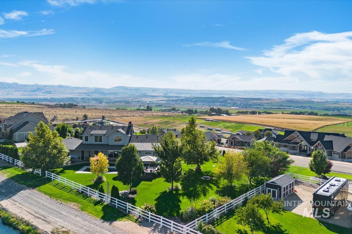 11326 West Rio Road Caldwell, ID 83607 - Photo 48 of 50 Aerial view of sparsely populated area with a mountainous background and nearby suburban area