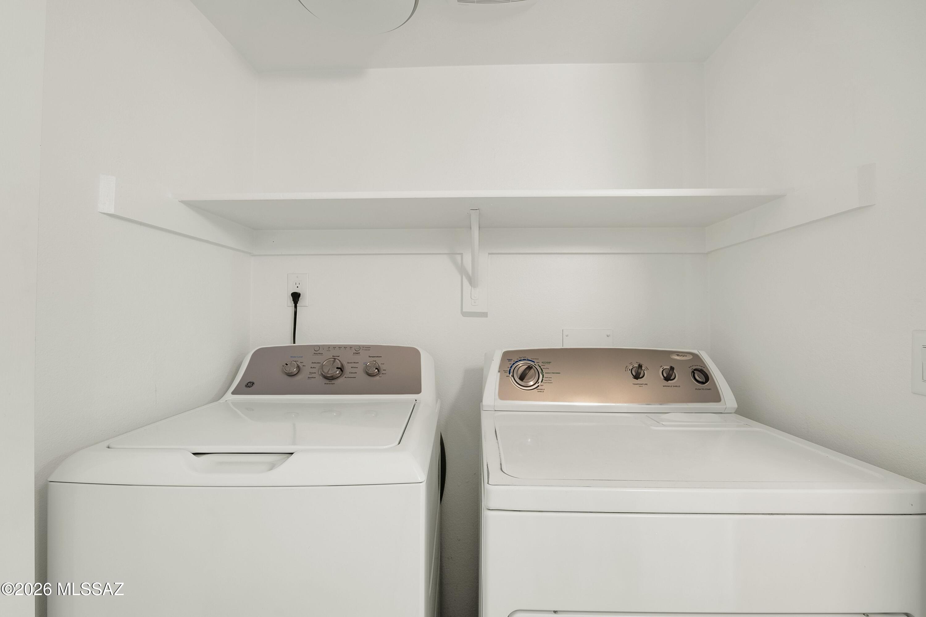7408 East Wandering Road Tucson, AZ 85750 - Photo 18 of 25 a utility room with dryer and washer