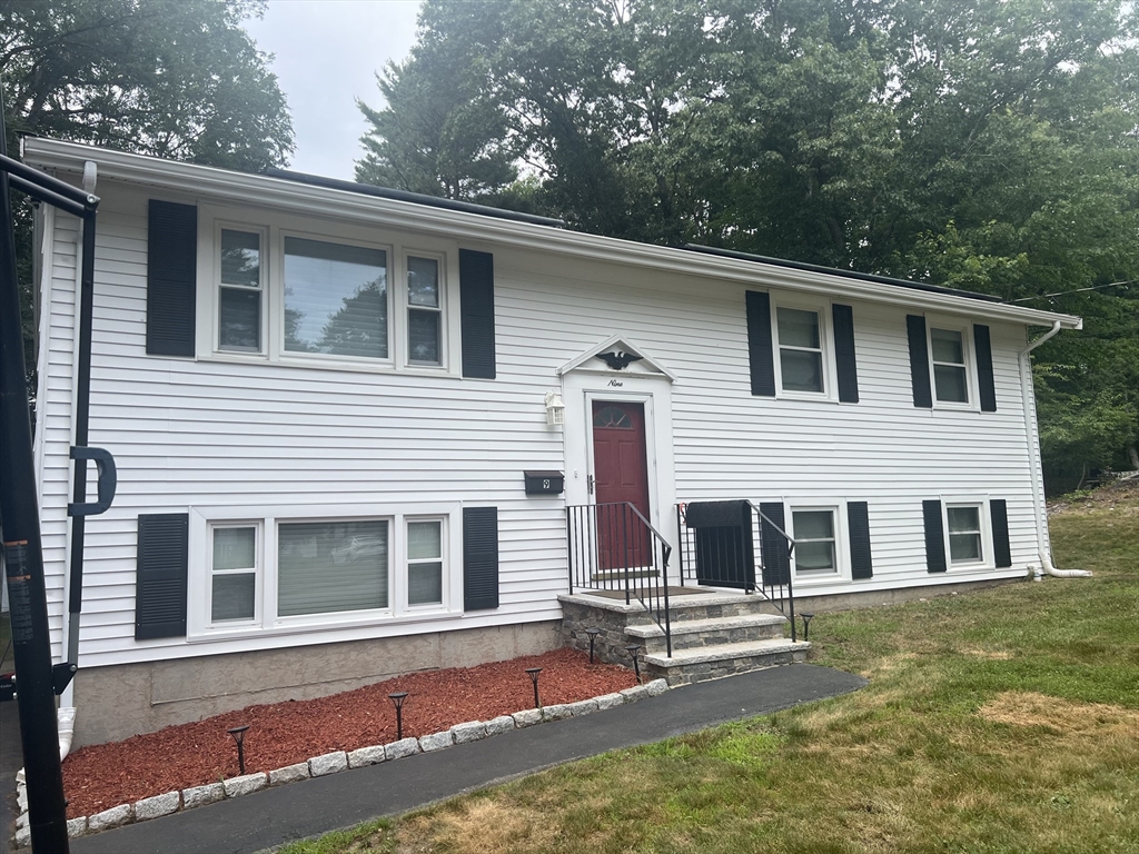 9 Spring Lane Sharon, MA 02067 - Photo 1 of 14 a view of a house with a yard