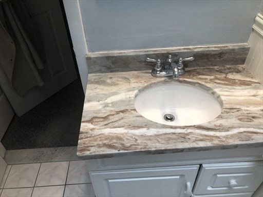 9 Spring Lane Sharon, MA 02067 - Photo 6 of 14 a bathroom with a granite countertop sink and a mirror