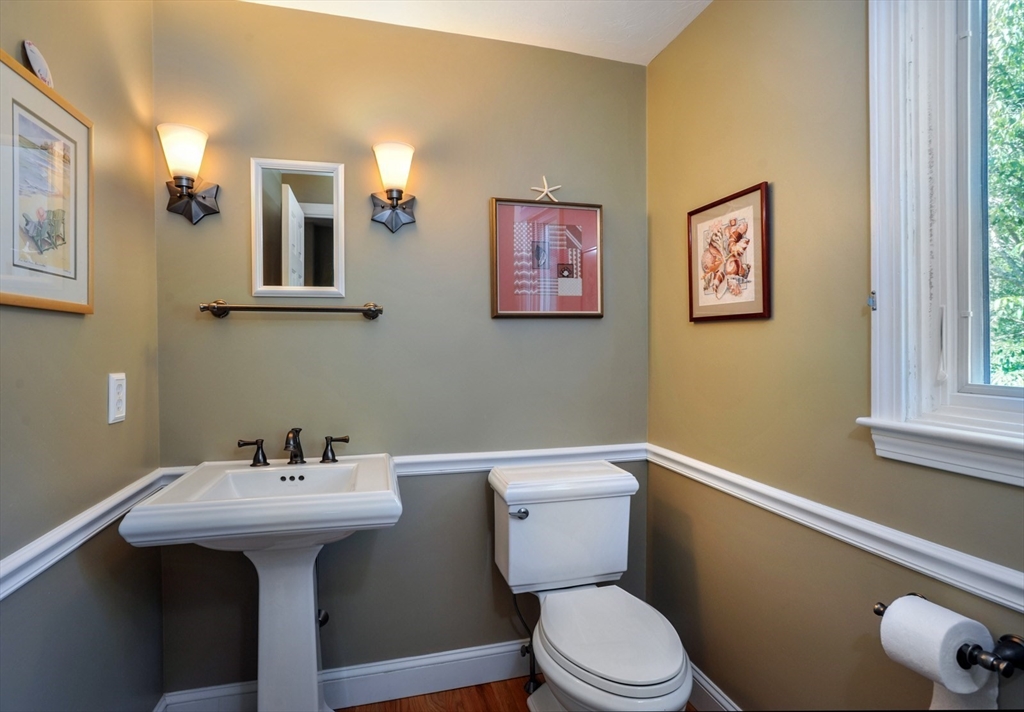 56 Bay Farm Road, Unit 56 Duxbury, MA 02332 - Photo 11 of 20 a bathroom with a sink mirror and toilet