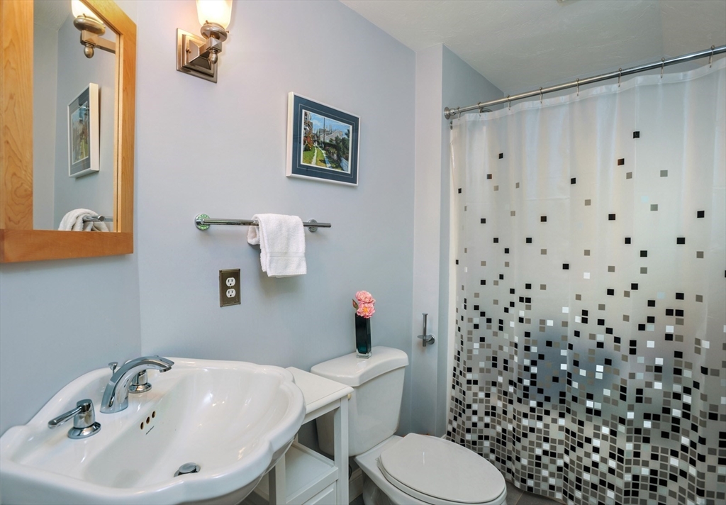 56 Bay Farm Road, Unit 56 Duxbury, MA 02332 - Photo 13 of 20 a bathroom with a sink and a toilet