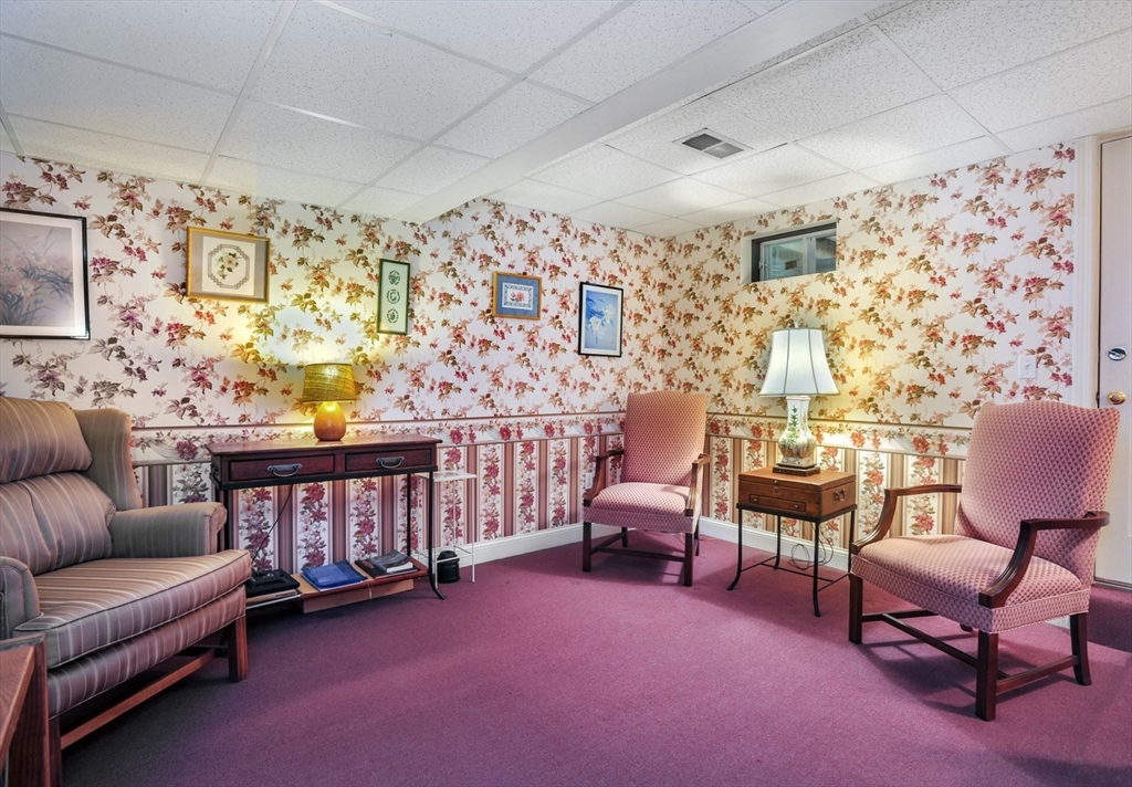 56 Bay Farm Road, Unit 56 Duxbury, MA 02332 - Photo 17 of 20 a living room with furniture and a flat screen tv