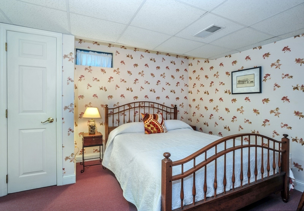 56 Bay Farm Road, Unit 56 Duxbury, MA 02332 - Photo 18 of 20 a bedroom with a bed and a white cabinet