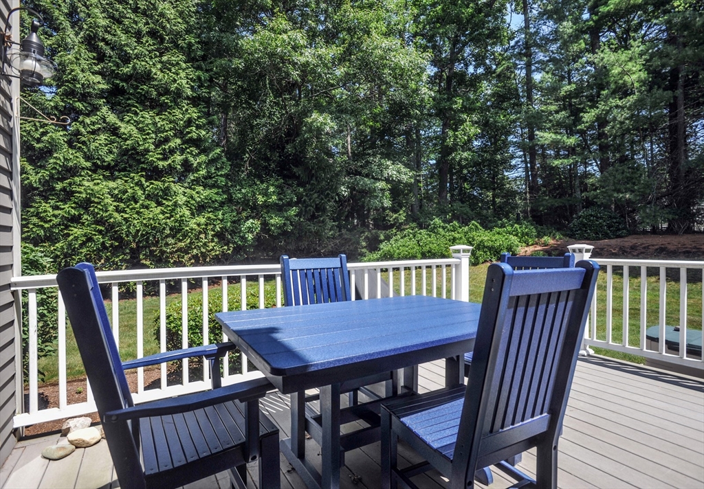 56 Bay Farm Road, Unit 56 Duxbury, MA 02332 - Photo 20 of 20 a view of a deck with a table and chairs