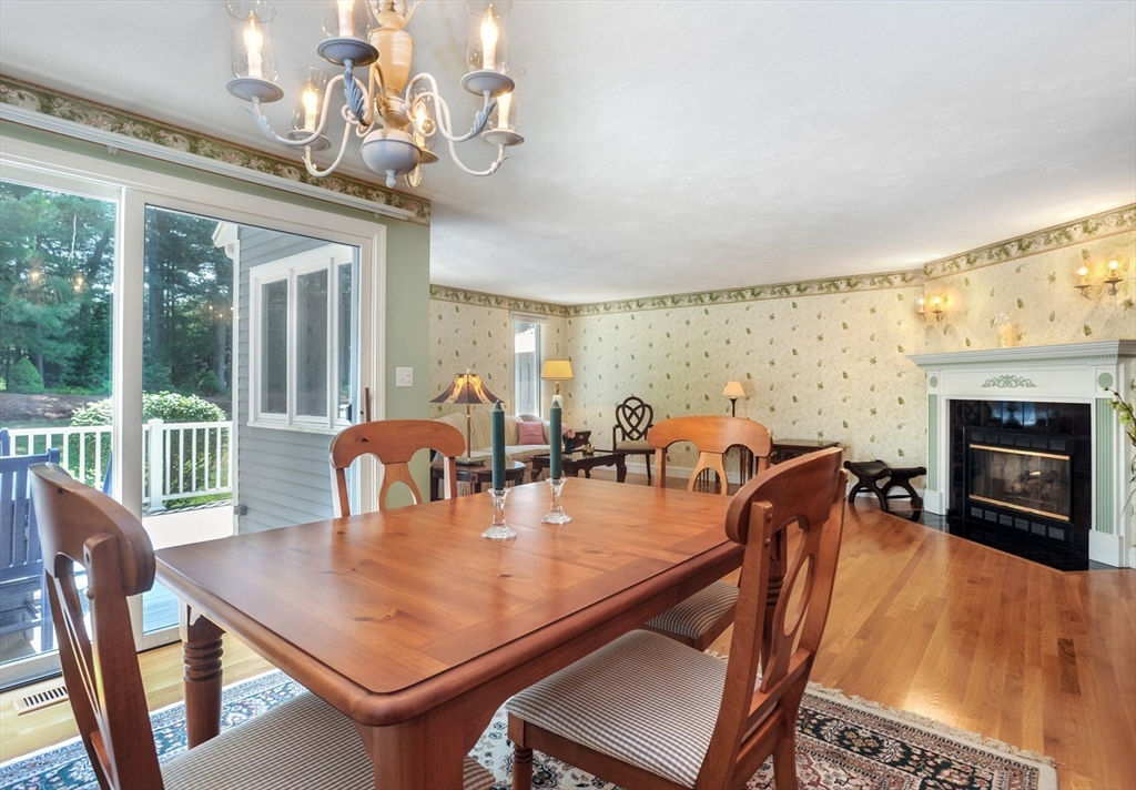 56 Bay Farm Road, Unit 56 Duxbury, MA 02332 - Photo 3 of 20 a dining room with furniture a chandelier and wooden floor