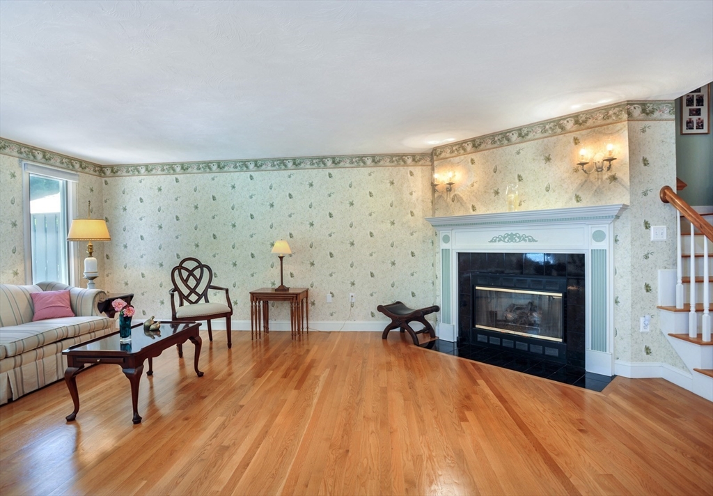 56 Bay Farm Road, Unit 56 Duxbury, MA 02332 - Photo 4 of 20 a living room with furniture and a fireplace