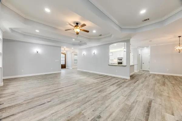 a kitchen with stainless steel appliances granite countertop a sink a refrigerator and a granite counter tops