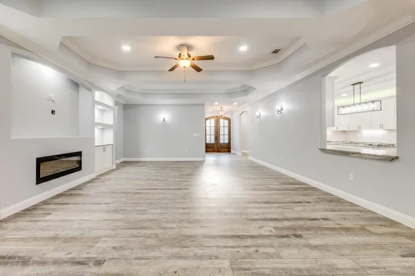 a kitchen with granite countertop a sink stainless steel appliances and cabinets