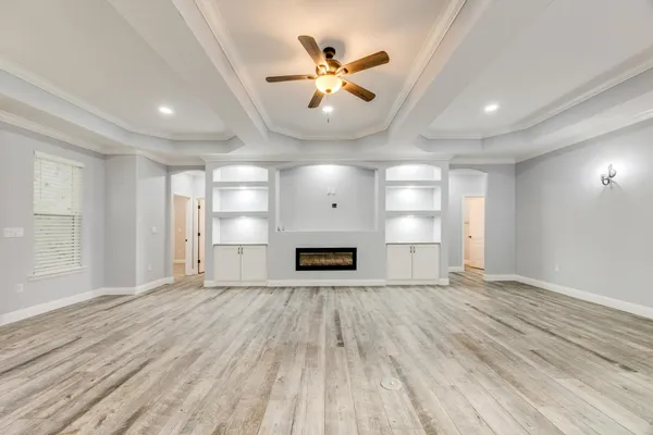 a kitchen with stainless steel appliances granite countertop a stove and a white cabinets