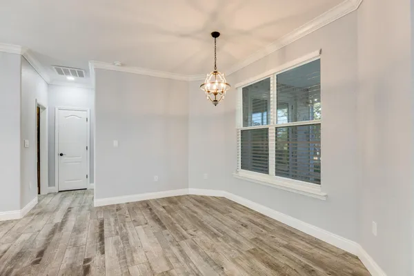 a kitchen with kitchen island granite countertop a sink stainless steel appliances and cabinets