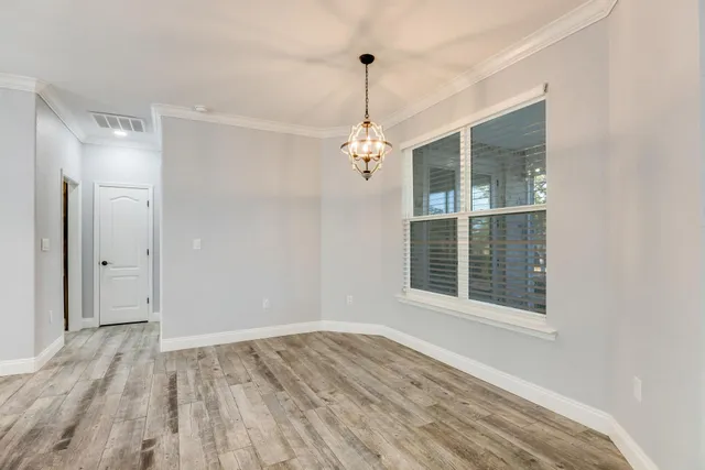 a kitchen with kitchen island granite countertop a sink stainless steel appliances and cabinets