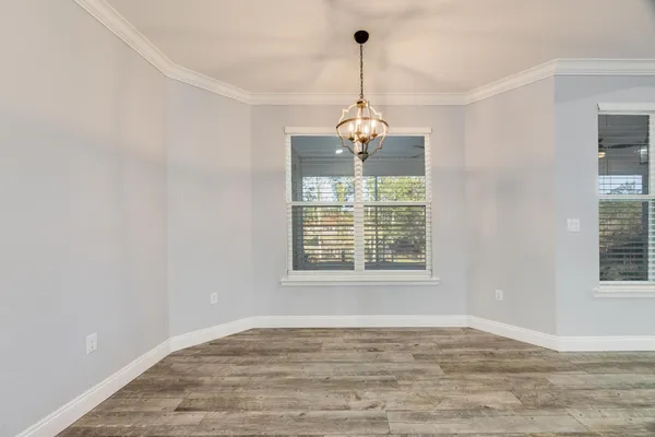 a kitchen with stainless steel appliances granite countertop a refrigerator and a granite counter tops