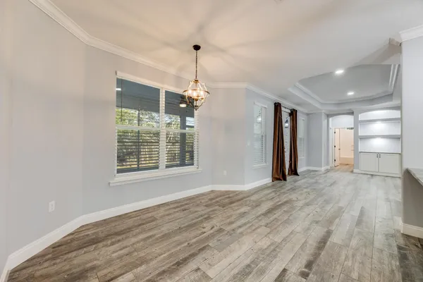 a kitchen with granite countertop a stove and cabinets