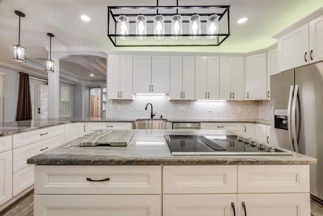 a view of a hallway with wooden floor and entryway