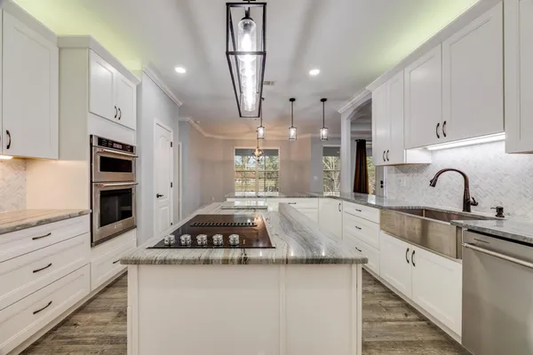 wooden floor in an empty room with a ceiling fan