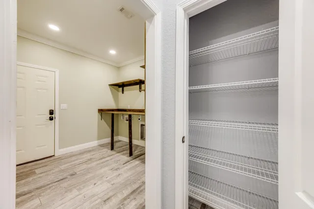 en empty room with fan and a ceiling fan