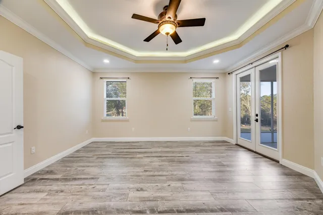 a bathroom with a sink a toilet a mirror and shower
