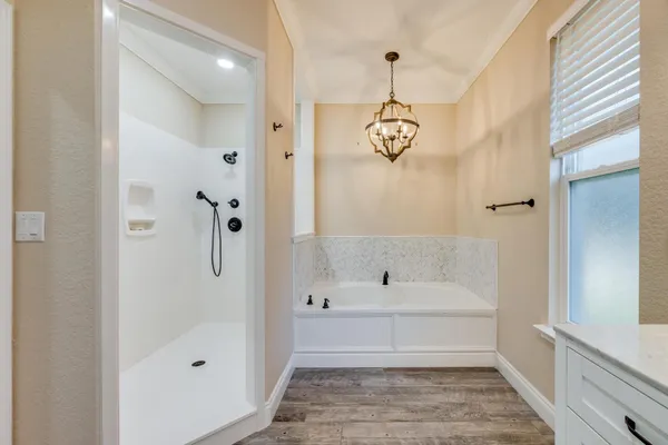 a front view of house with yard and trees in the background