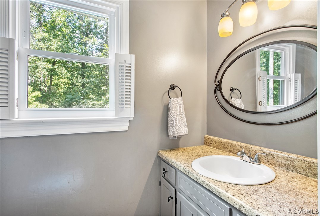 1213 Kingscross Road Midlothian, VA 23114 - Photo 23 of 39 a bathroom with a sink and a mirror