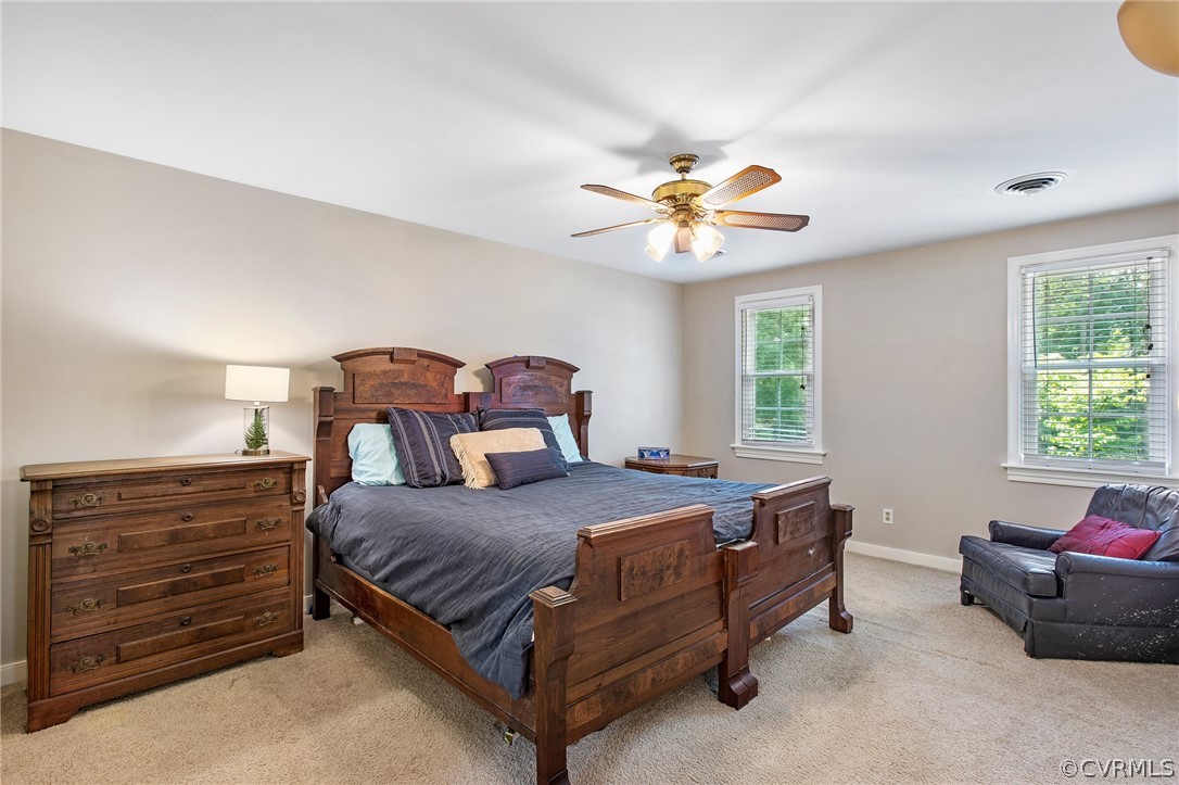 1213 Kingscross Road Midlothian, VA 23114 - Photo 25 of 39 a bedroom with a bed and a chandelier