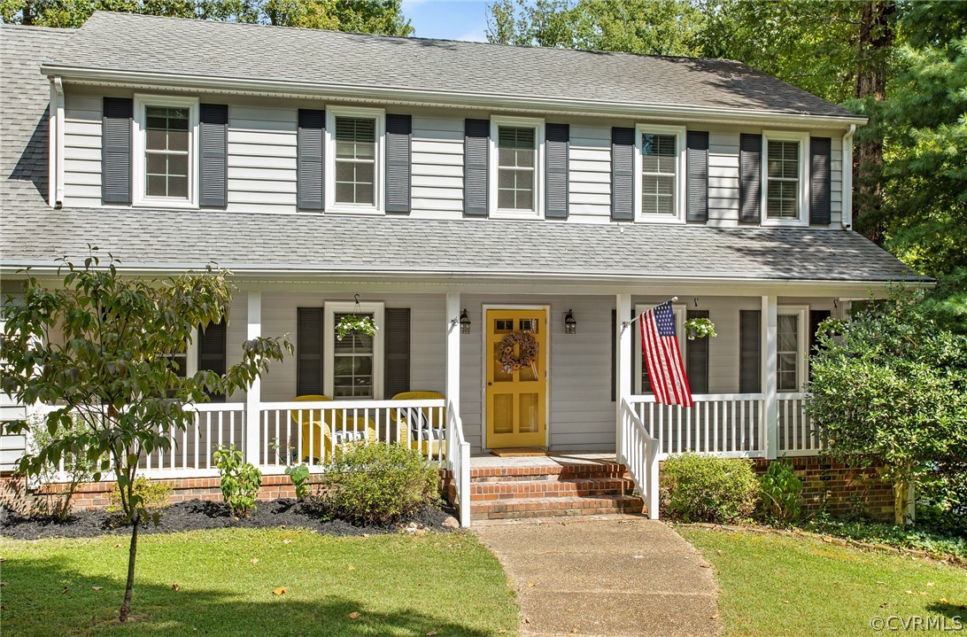 1213 Kingscross Road Midlothian, VA 23114 - Photo 3 of 39 a view of a house with a yard and plants