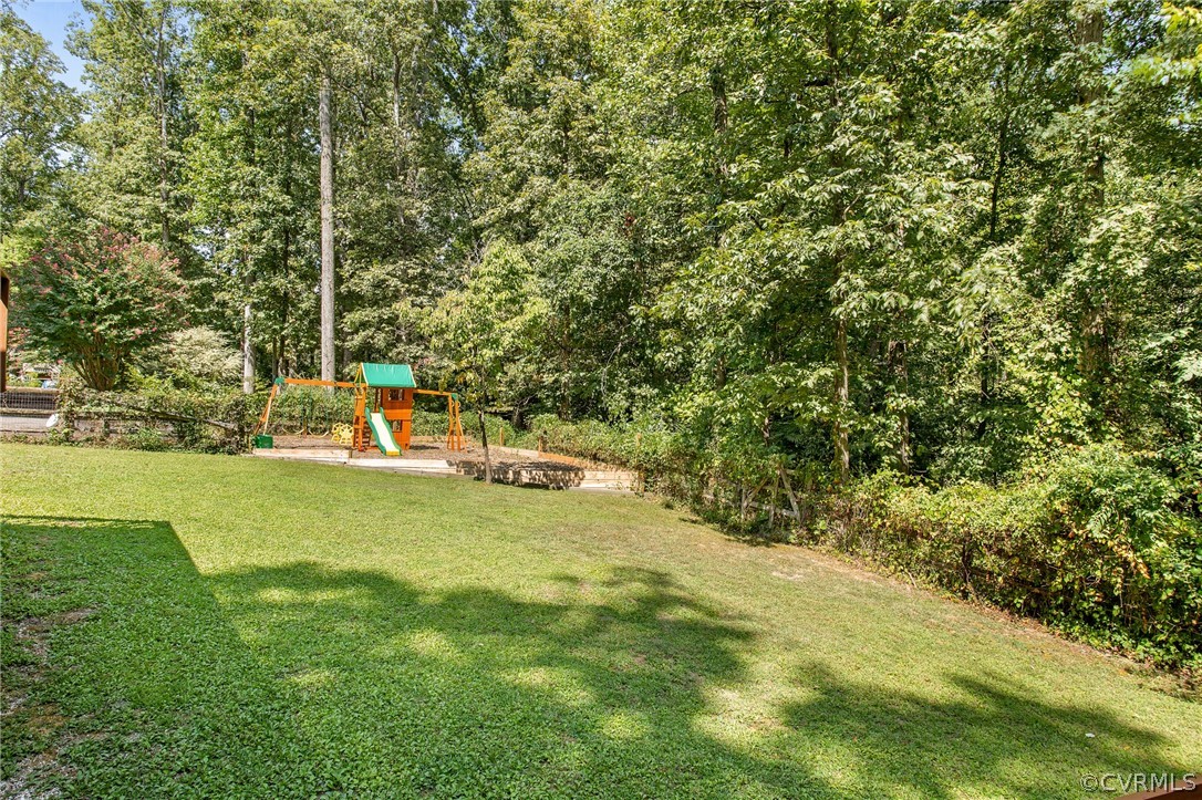 1213 Kingscross Road Midlothian, VA 23114 - Photo 36 of 39 a view of a yard with a trees